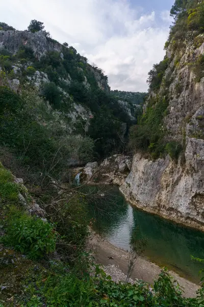 stock image View of canyon of the Anapo valley with river at the nature reserve Pantalica, Siracusa, Sicily, Italy