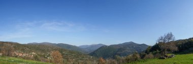 Panoramic view of the greek rural countryside with village of Figaleia on a sunny spring day, Phigalia, Peloponnese, Greece clipart