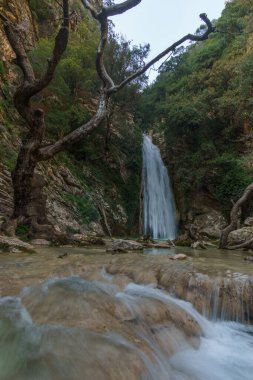 Beautiful natural waterfall of Neda with pool of torquoise water in the rural countryside, Phigalia, Peloponnese, Greece clipart