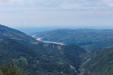 Beautiful view at greek countryside with valley of river Neda to the mediterranean sea on a sunny spring day, Phigalia, Peloponnese, Greece clipart