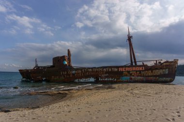 Abandoned stranded dimitrios shipwreck at the beach of Valtaki, Peloponnese, Greece clipart