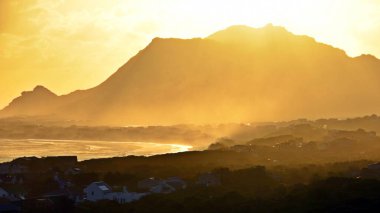 Landscape with a beautiful sunset over Betty's Bay and the False Bay clipart