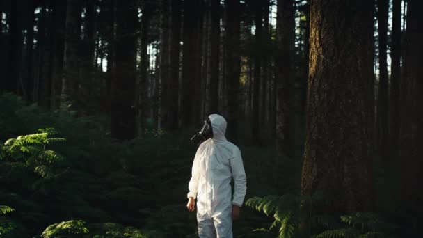 Man White Overalls Walks Gas Mask Forest — Stock Video