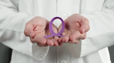 Close up of Doctor with colored bow in hands