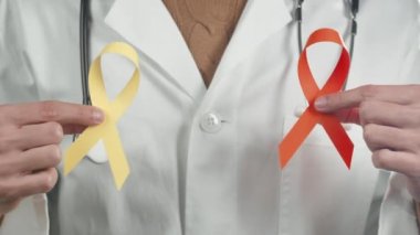 Close up of Doctor with colored bow in hands