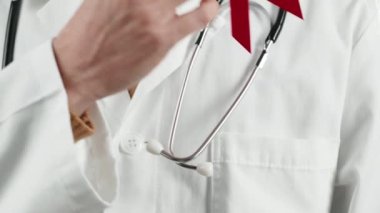 Close up of Doctor with colored bow in hands