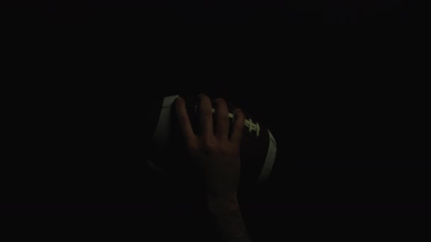 Hand Holding Football Ball Black Background — 图库视频影像