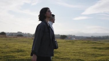 Engaged couple outdoor in a field 