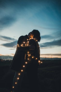 Couple with little light outdoor