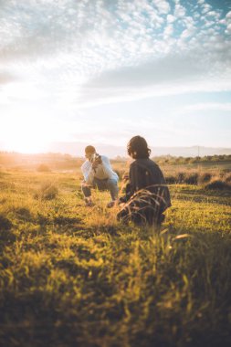 Couple With Vintage Camera at sunset.