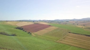 Aerial view of expanse of rolling cultivated hills