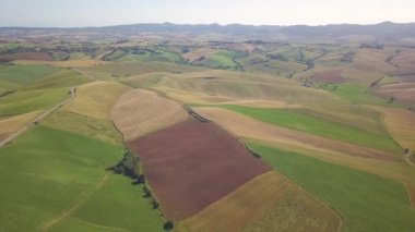 Aerial view of expanse of rolling cultivated hills
