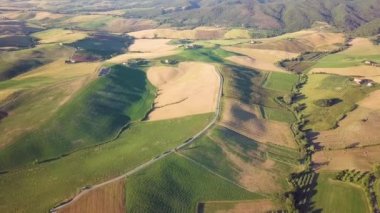 Aerial view of expanse of rolling cultivated hills
