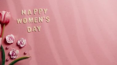 Happy Womens Day sing on pink Background.