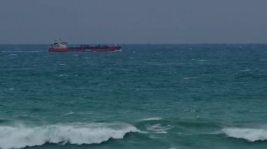 Cargo ship in stormy ocean 