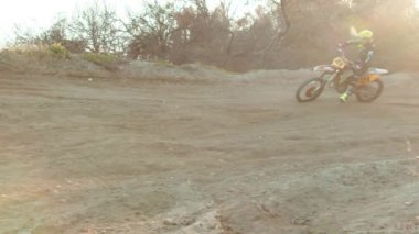 Aerial view of bikers are racing on the beach with motocross