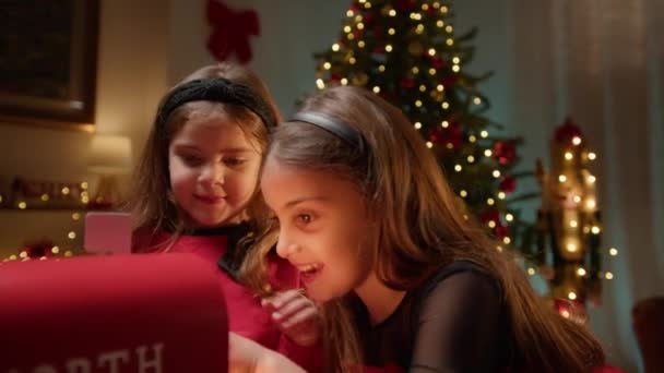 Two Young Sisters Putting Letters Santa Mailbox — Stock Video