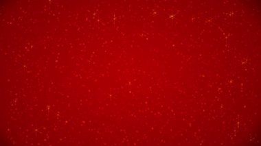 Golden sparkles on a red background with copy space for titles, text, or logos. 