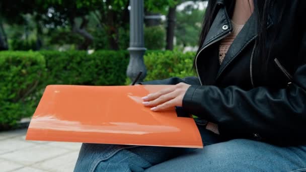 Woman Opening Study Folder Park — Stock Video