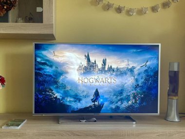 Prague, Czech Republic - November 14 2023: Hogwarts Legacy game on Panasonic LCD TV running on Nintendo Switch gaming console. A new game from the world of Harry Potter. High quality photo clipart