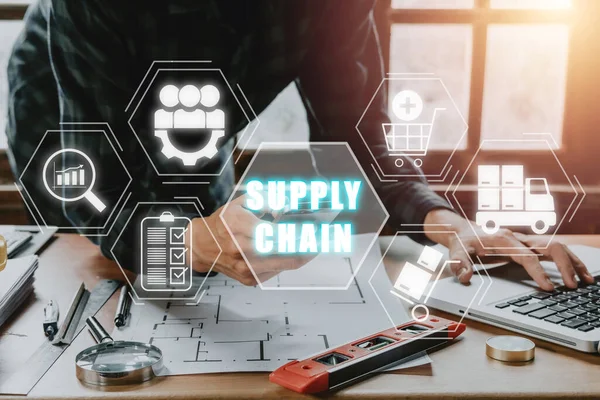 Supply chain management concept, Engineer man working on laptop computer and smart phone with supply chain icon on virtual screen.