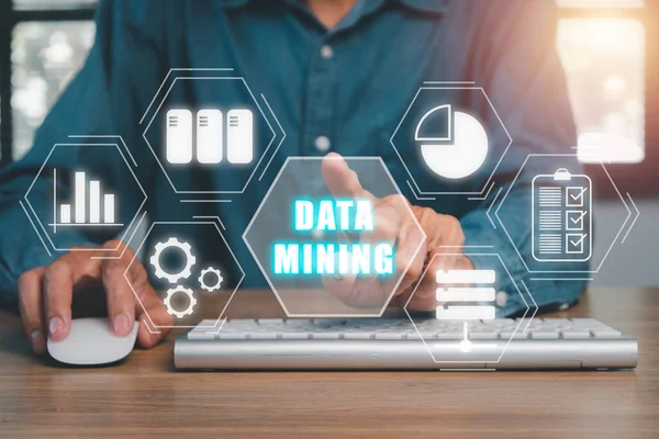 Data mining for business and organization, Businessman hand touching data mining icon on VR screen, internet and networking concept.