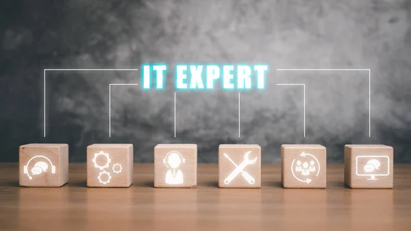 IT expert concept, Cubes wooden block with it expert icon on virtual screen, Information Technology Advice or Services.