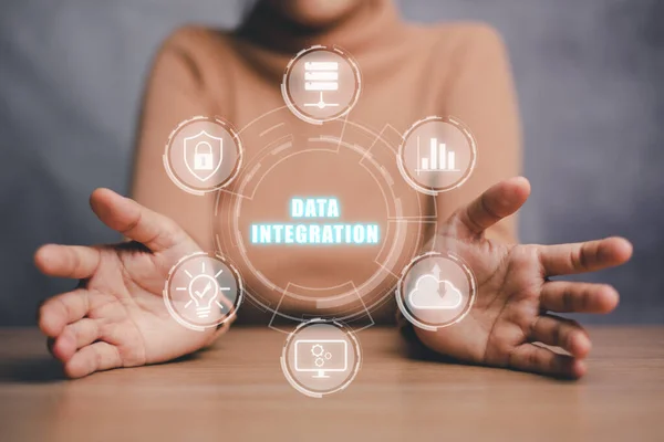 Data integration concept, Person hand holding data integration icon on virtual screen.