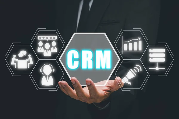 CRM Customer Relationship Management Business Internet Techology Concept, Man hand holding customer Relationship Management icon on VR creen.