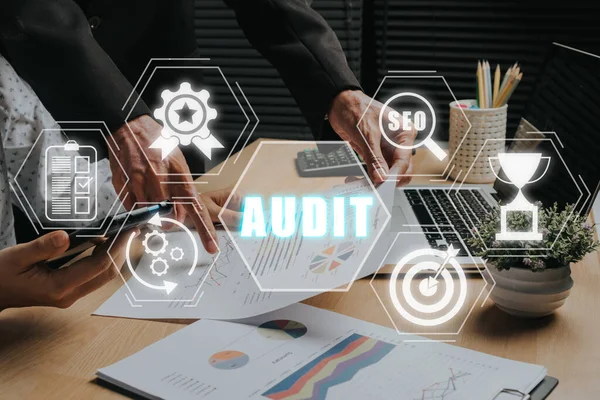 Audit Internal Financial Examination Accounting Business Finance concept, Business team analyzing data on office desk with Audit business icon on virtual screen.
