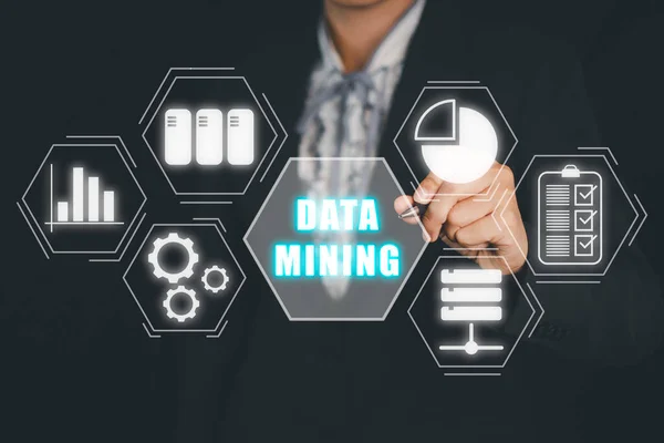 Data mining for business and organization, Business woman hand touching data mining icon on VR screen, internet and networking concept.