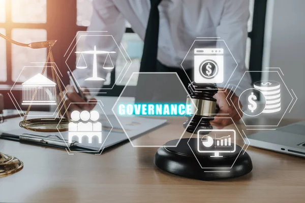 Compliance Rules Law Regulation Policy Business Technology concept, Male judge in a courtroom using the gavel with governance icon on virtual screen.