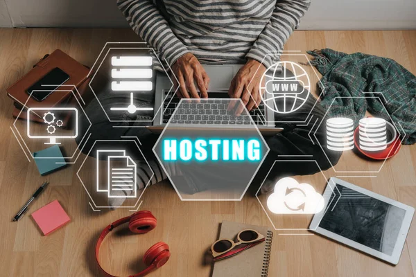 Web hosting concept, Person working on laptop computer with hosting icon on virtual screen, Internet, business, Technology and network concept.