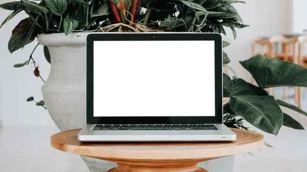 stock image Blank screen laptop computer set up for work on a wooden desk, Mockup, Empty screen, Blank screen for product display.