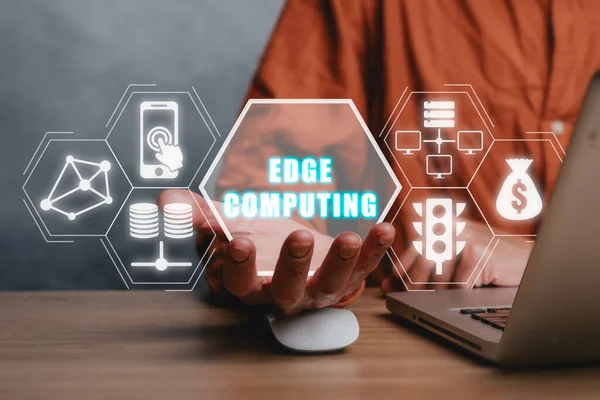 Edge computing modern IT technology concept, Businessman hand holding edge computing icon on virtual screen, Business, technology, internet and networking