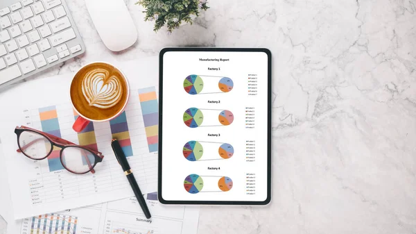 stock image Tablet with charts and reports on office desk workplace. Top view flat lay