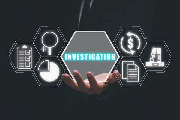stock image Investigation concept, Businessman hand holding investigation icon on virtual screen.
