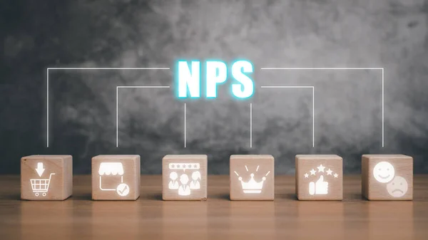 NPS, net promotor score concept, Wooden block on desk with net promotor score icon on virtual screen.