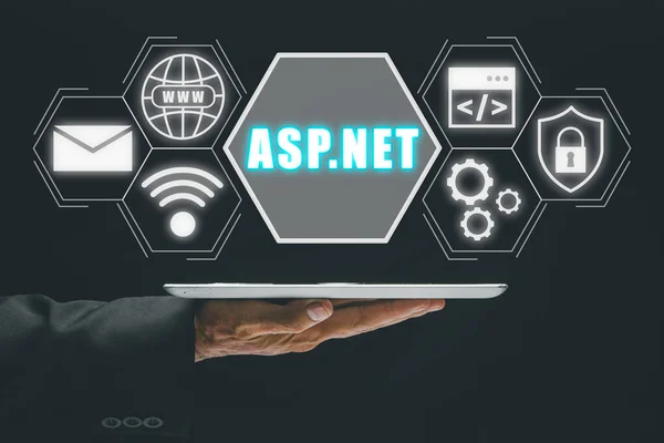ASP.NET Development programming language concept, Person using tablet with ASP.NET icon on virtual screen.