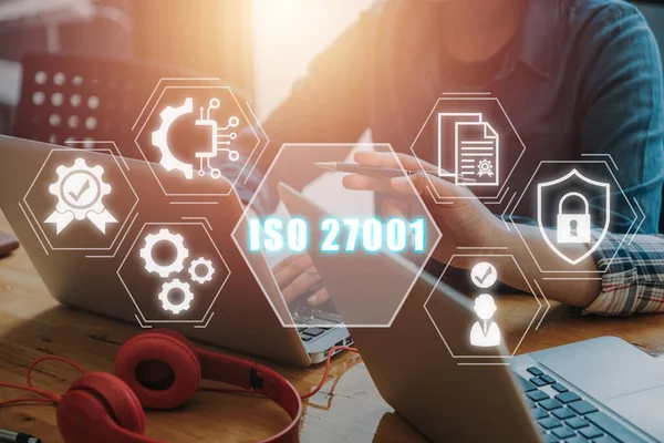 ISO 27001 Quality standards assurance business technology concept, Business team working on laptop analyzing income charts and graphs with iso 27001 icon on virtual screen.