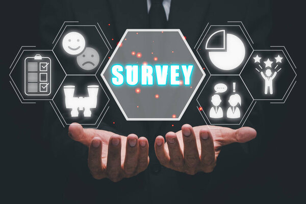 Survey concept, Business person hand holding survey icon on virtual screen.