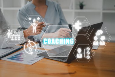 Coaching concept, Business person team working on laptop computer with coaching icon on virtual screen, Mentoring, Education, Business, Training, Development, E-learning.