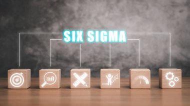 Altı sigma konsepti, masadaki tahta blok ve sanal ekranda altı sigma simgesi.