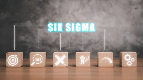 Six sigma concept, Wooden block on desk with six sigma icon on virtual screen.