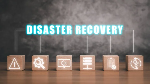 Disaster Recovery concept, Wooden block on desk with disaster recovery icon on virtual screen background, Data loss prevention.