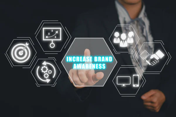 Increase brand awareness concept, Businesswoman hand touching increase brand awareness icon on virtual screen.