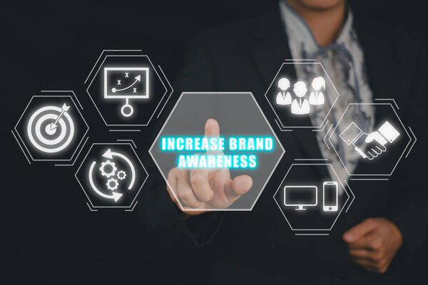 Повышение узнаваемости бренда, прикосновение руки предпринимательницы увеличит узнаваемость бренда на виртуальном экране.