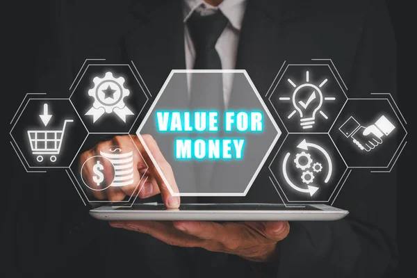 Value for money concept, Businessman using digital tablet with value for money icon on virtual screen.