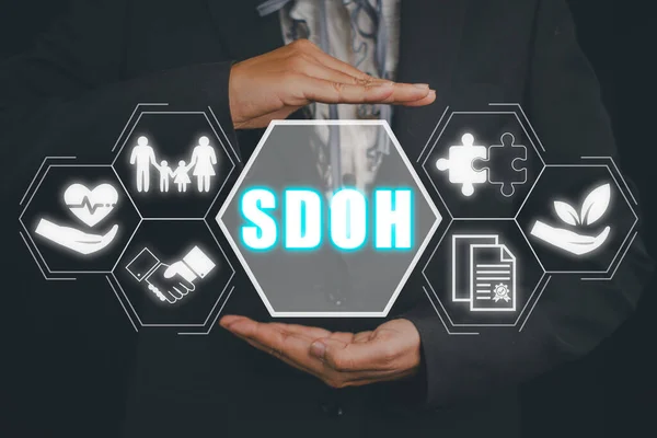 SDOH, Social Determinants Of Health concept, Businesswoman hand holding Social Determinants Of Health icon on virtual screen.