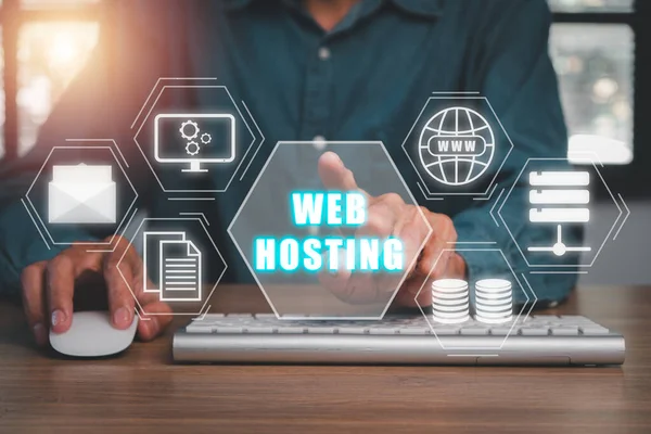 Web hosting concept, Person using computer and presses his finger on the virtual screen inscription Hosting on desk, Internet, business, Technology and network concept.